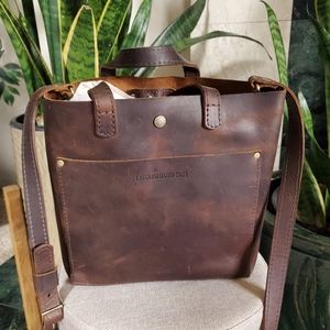 Portland leather mini tote with snap closure.